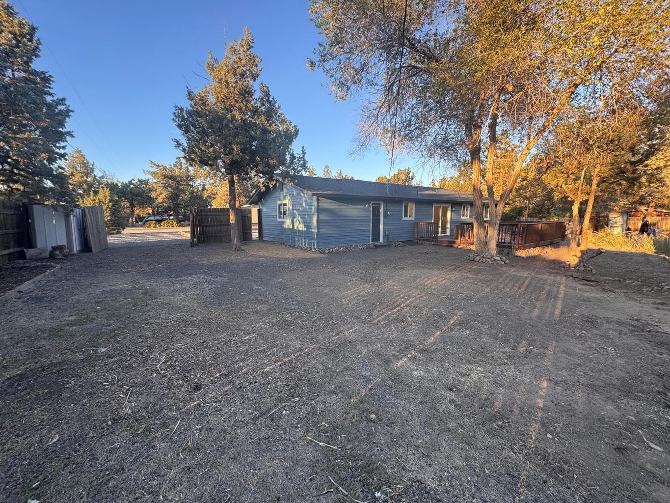 Double gate creates ample parking areas behind the fence.