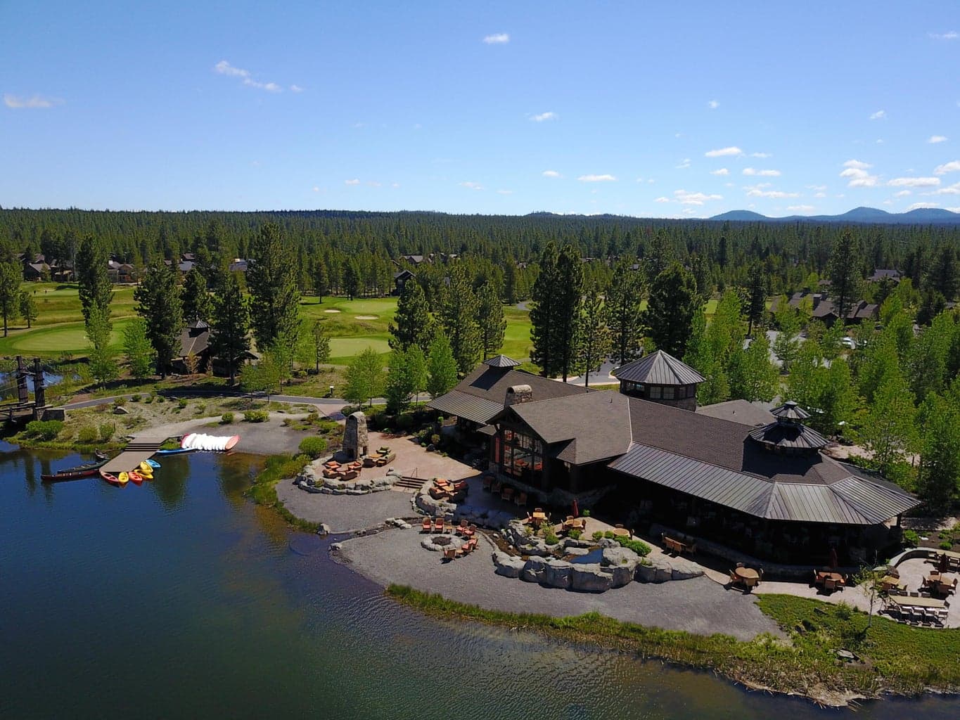 Overlooking snow-capped Mt. Bachelor, the Caldera Springs Lake House & Pool and Fitness Building are the heart of this resort community.