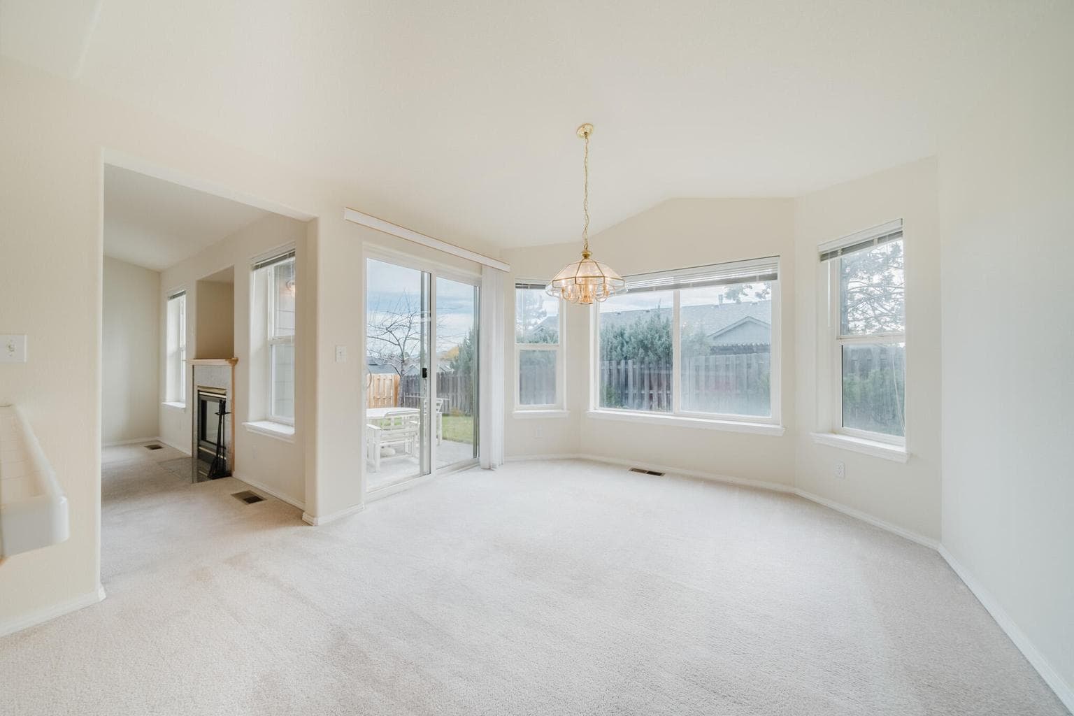 Dining Room has a wall of windows and a sliding glass door for a healthy amount of natural light and vitamin D production.