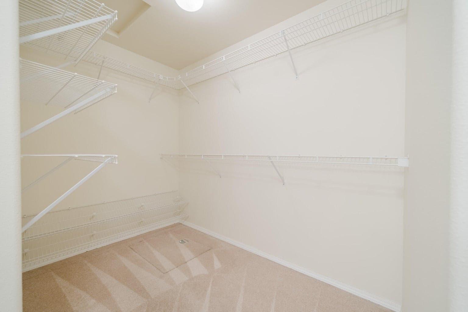 Walk-in closet in the primary suite.