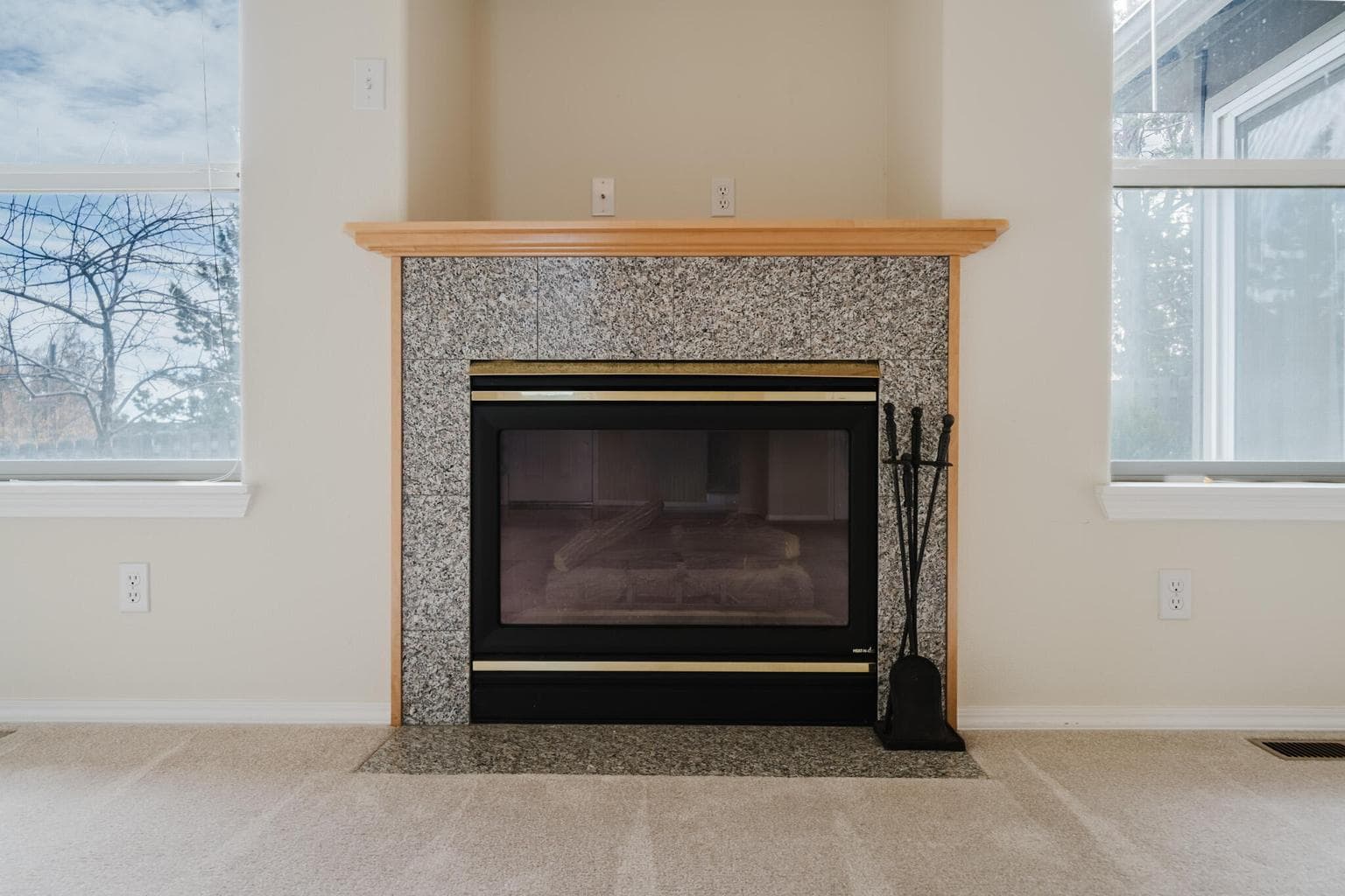 Gas fireplace anchors the living room space.