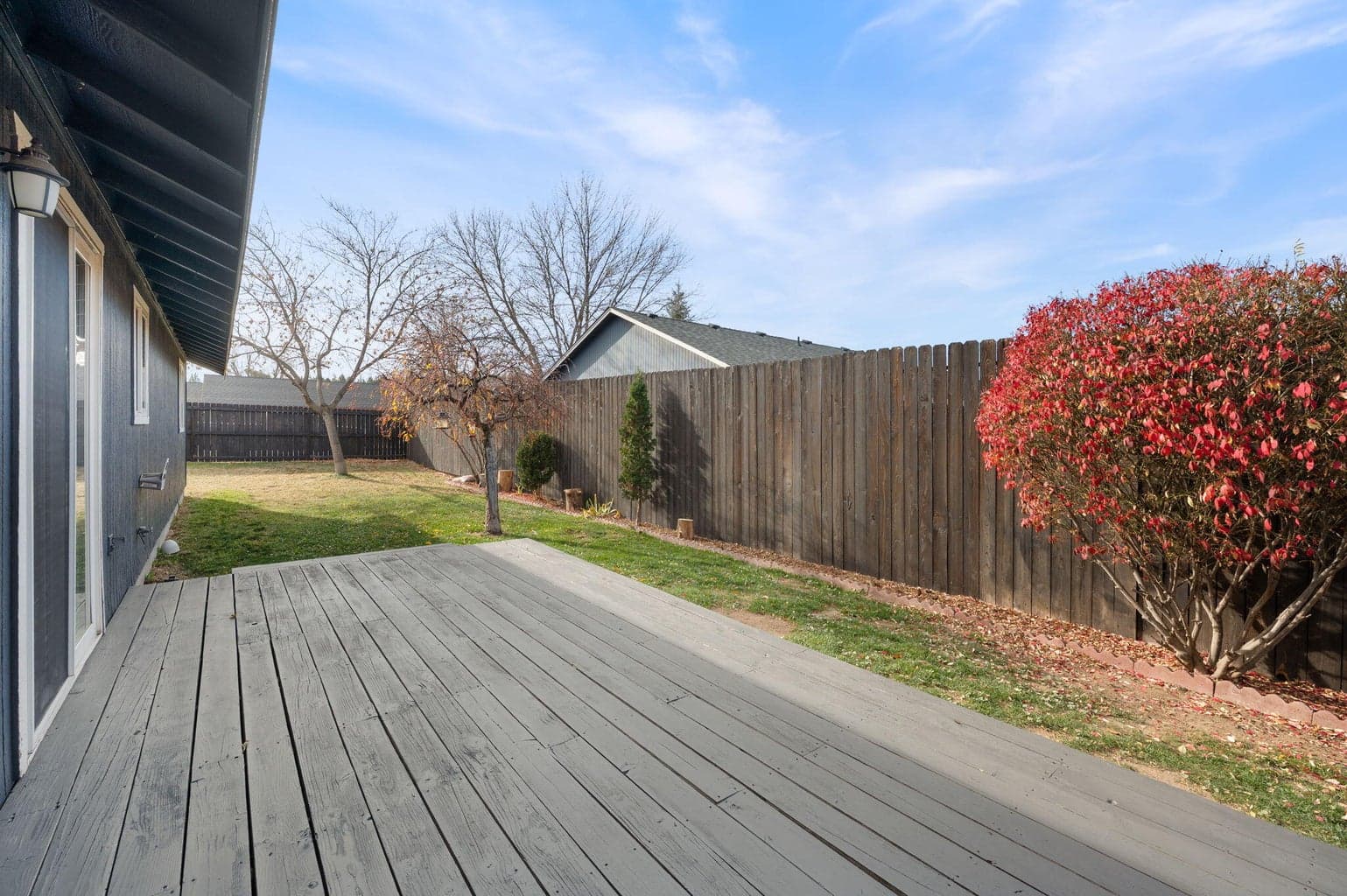 Freshly stained. the fence is 8 ' in the back so it makes this space feel private.