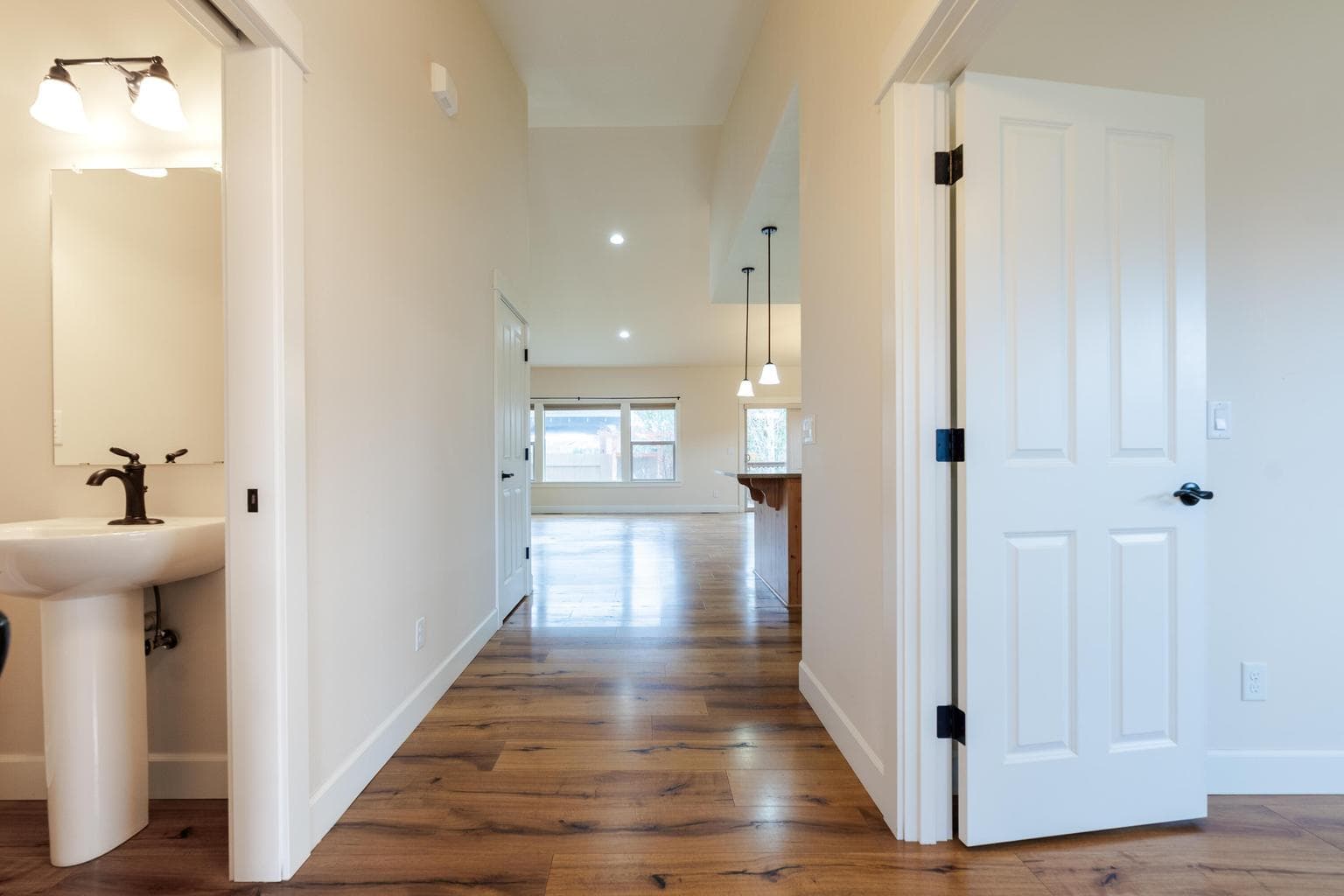 Front door entry, office and powder room with opening to Living room, dining and kitchen