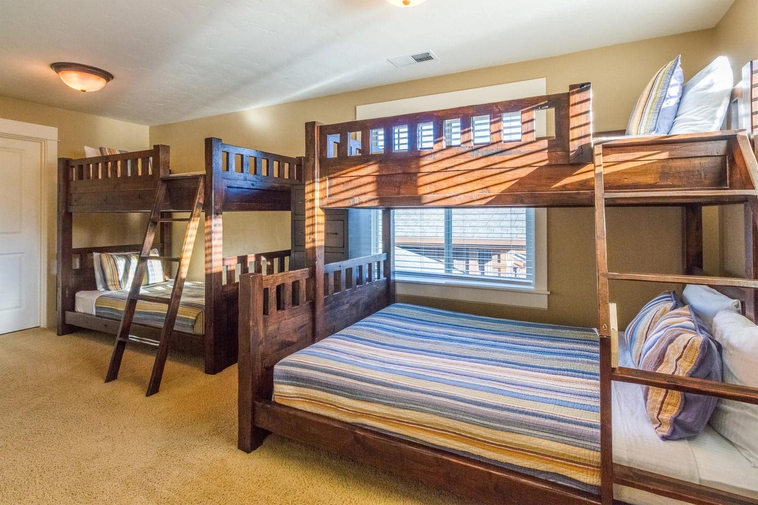 The spacious 6th bedroom sleeps up to 5 with a pyramid bunk + standard bunk