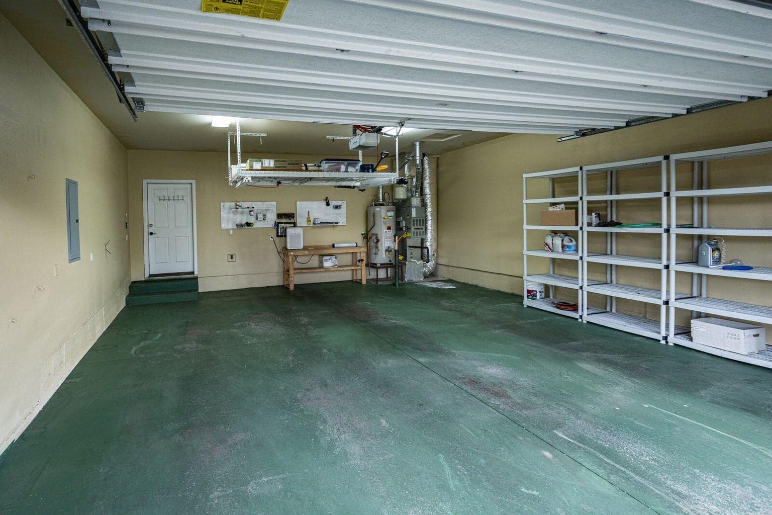 2 car garage with hanging storage rack included in the sale.