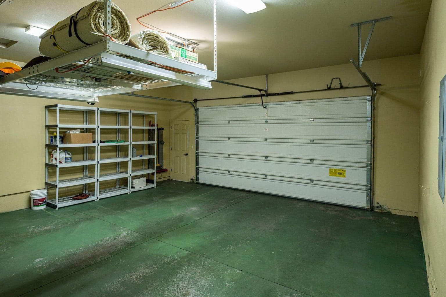 Storage units along the wall are also included in the sale.