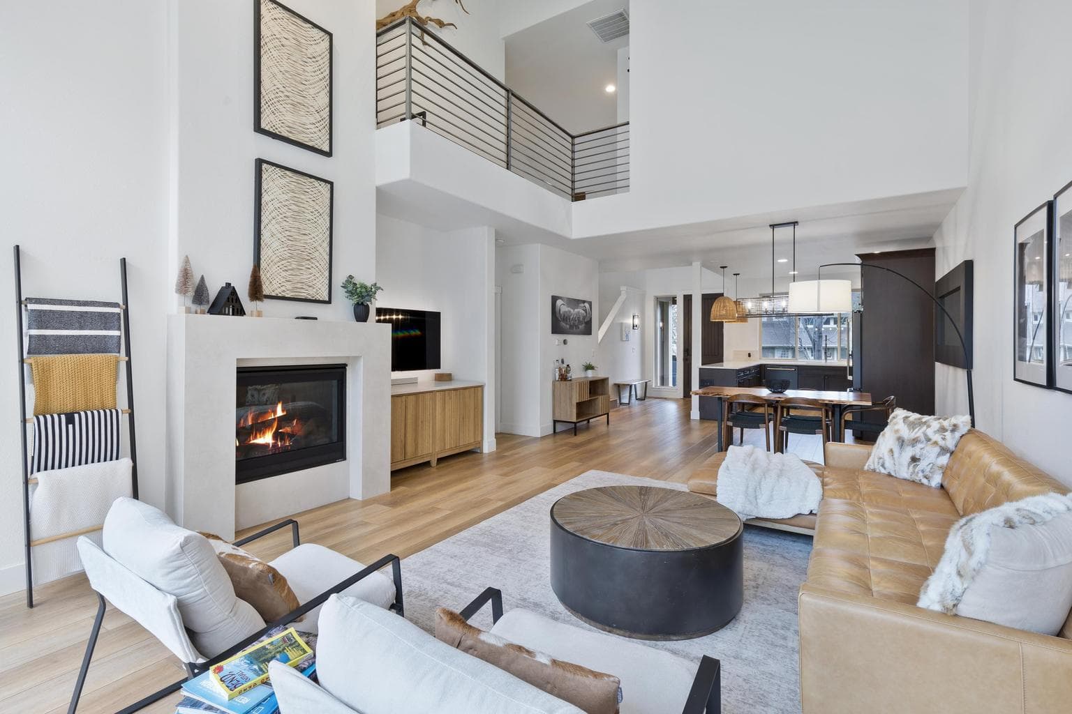 Soaring vaulted ceilings, new flooring throughout, and a loft area upstairs.