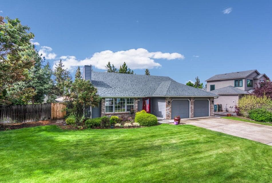 Large lawn in front of home and also in the rear cared for by the HOA