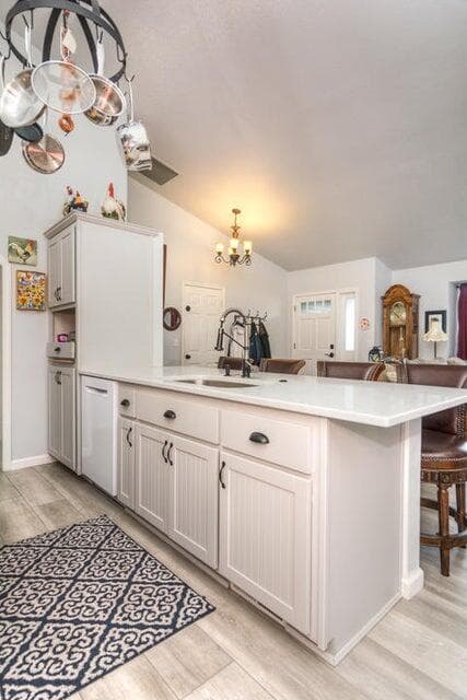 From the dining area into the kitchen island with entertaining sink into great room
