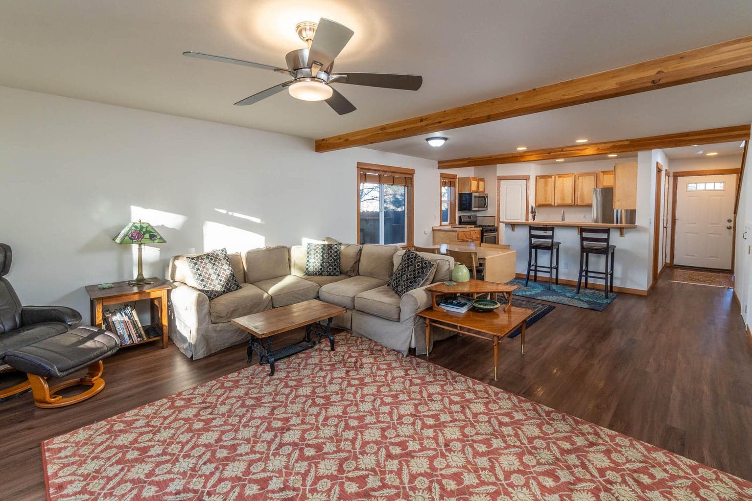 Enter into the open living room and kitchen with breakfast bar and gas fireplace