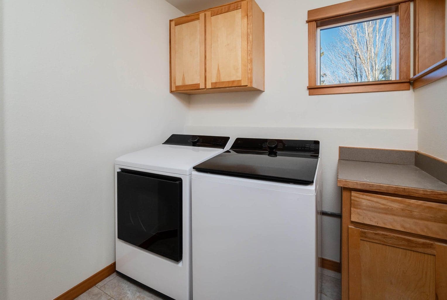 Laundry room with brand new washer and dryer