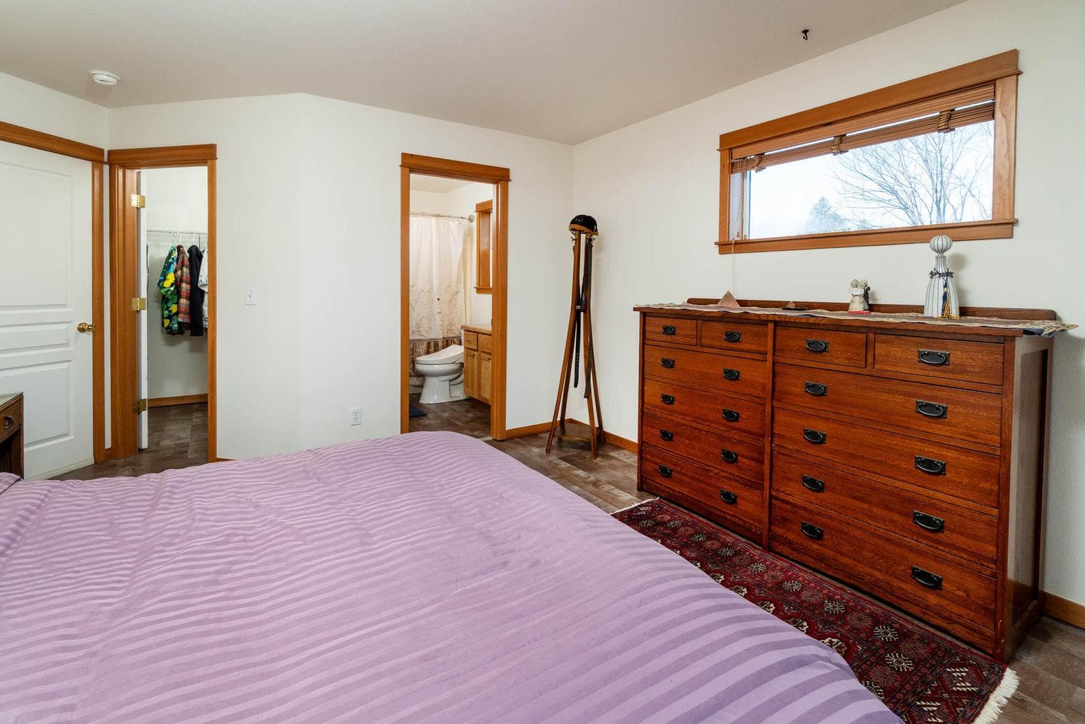 Primary Bedroom with attached full bath, walk-in closet and views of west hills and mountains