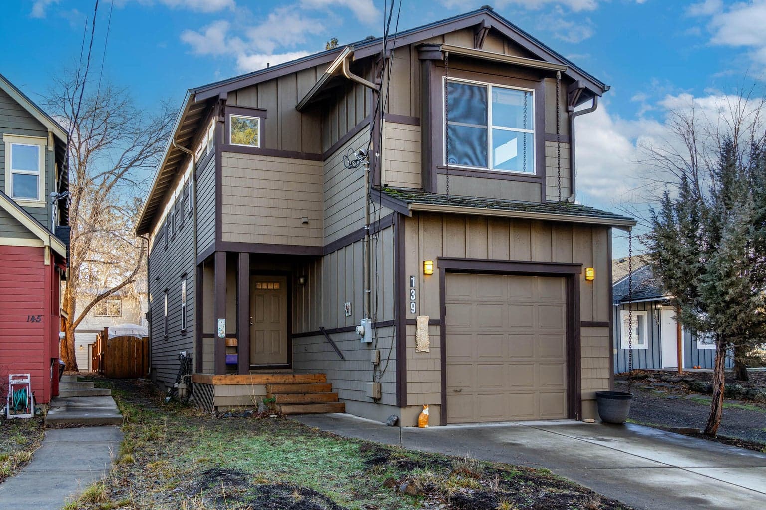 Front of the house with spacious single car garage and overhead storage area