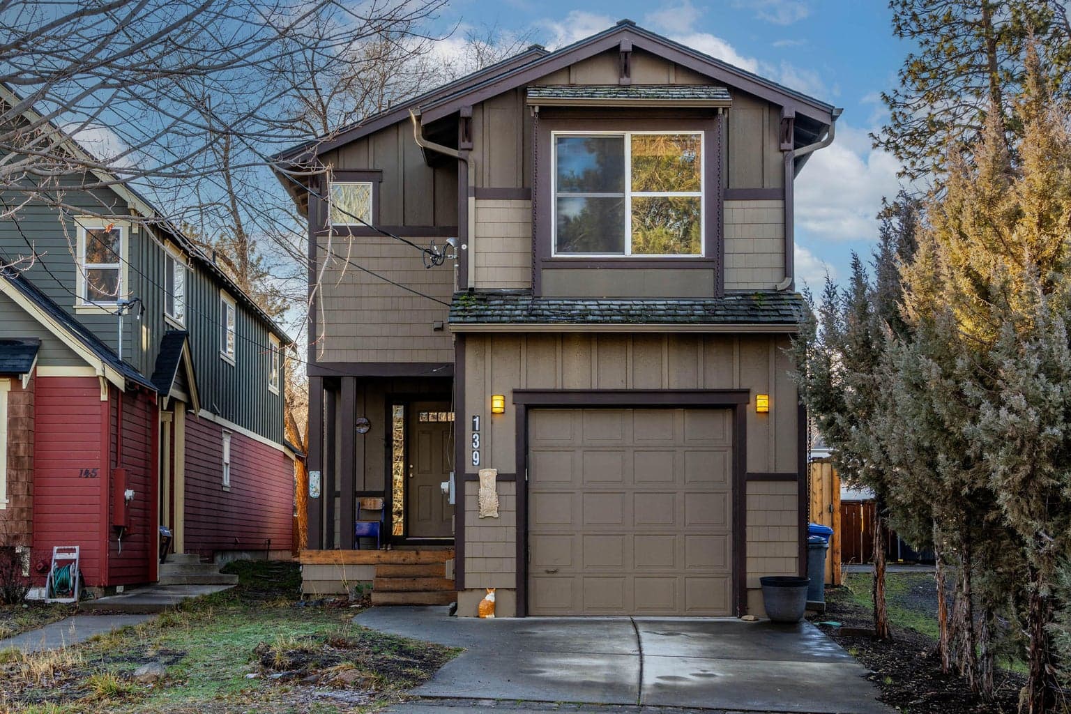 Front of the house with spacious single car garage and overhead storage area
