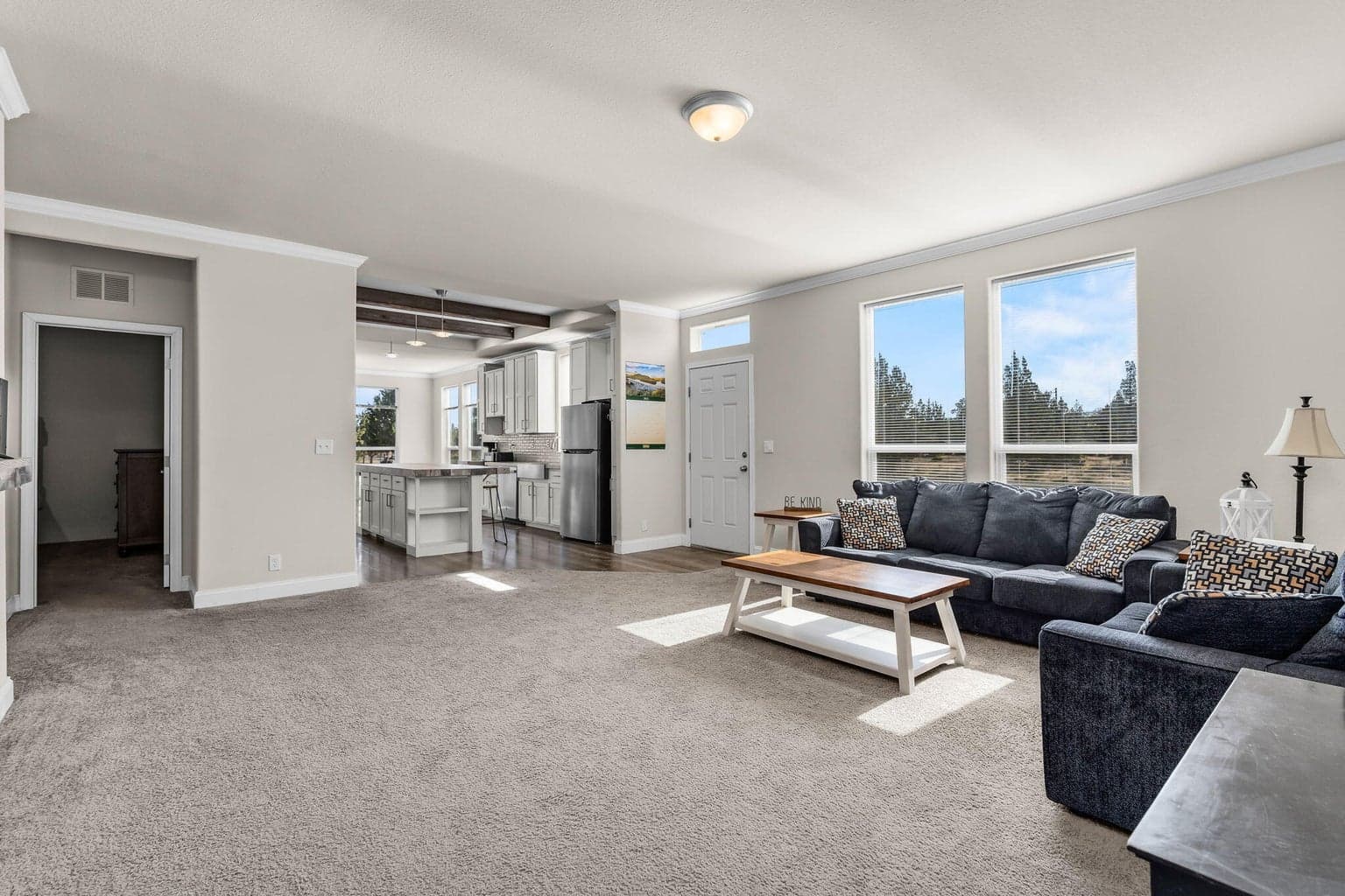 Oversized windows flood the space with natural light while offering expansive views of the surrounding high desert.