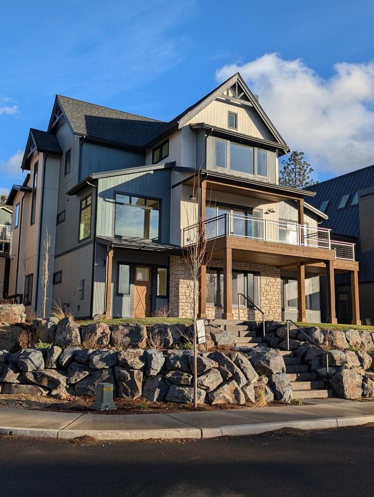 The front perimeter of the house which can have a gorgeous black metal fence put around it that matches the deck railing