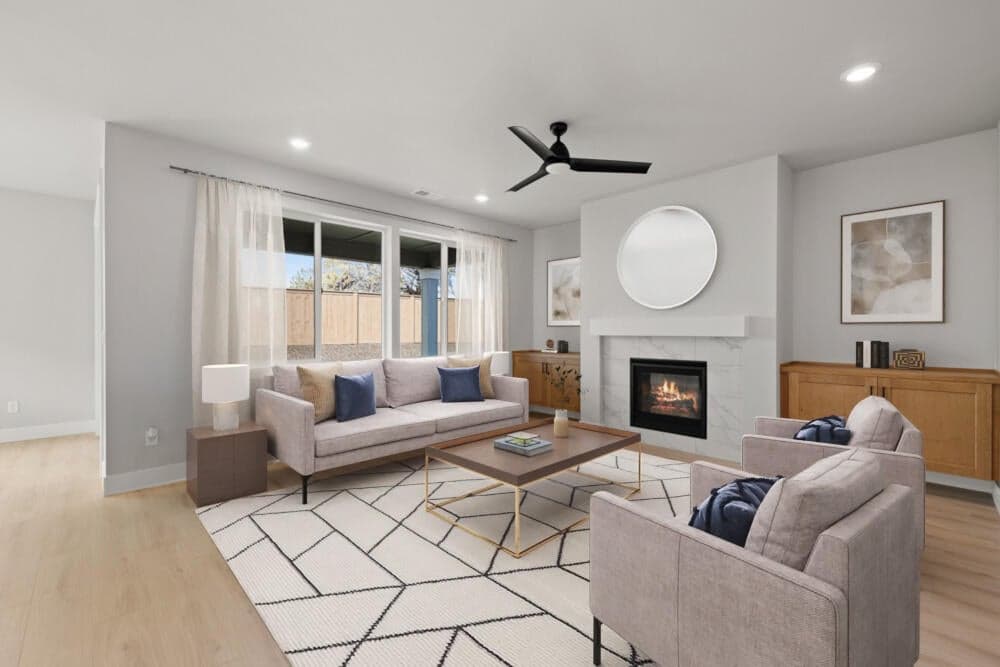 Great room with gas fireplace. Photo has been virtually staged.