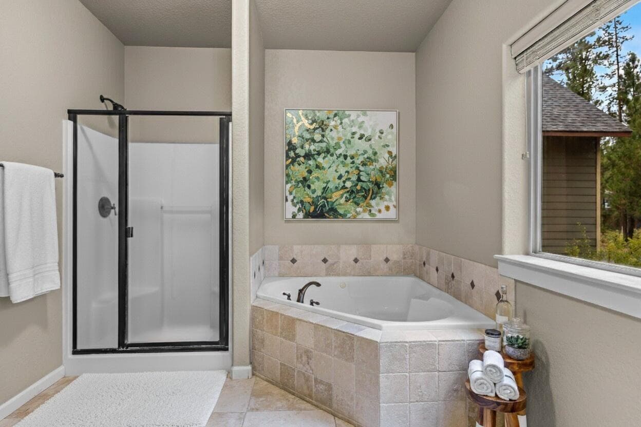 Primary bathroom with soaker tub - Virtually Staged