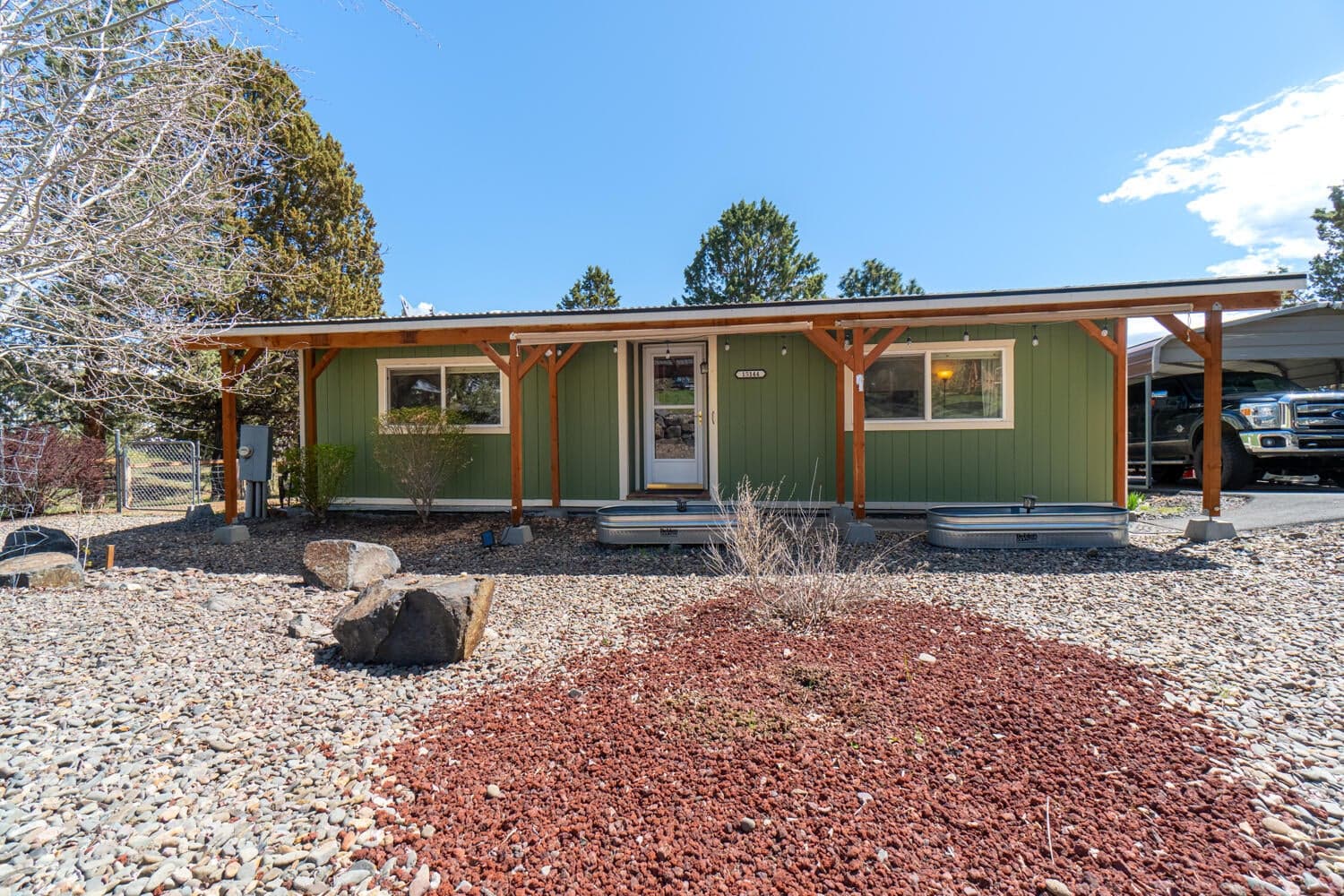 Covered entryway & low maintenance landscaping during the spring time.