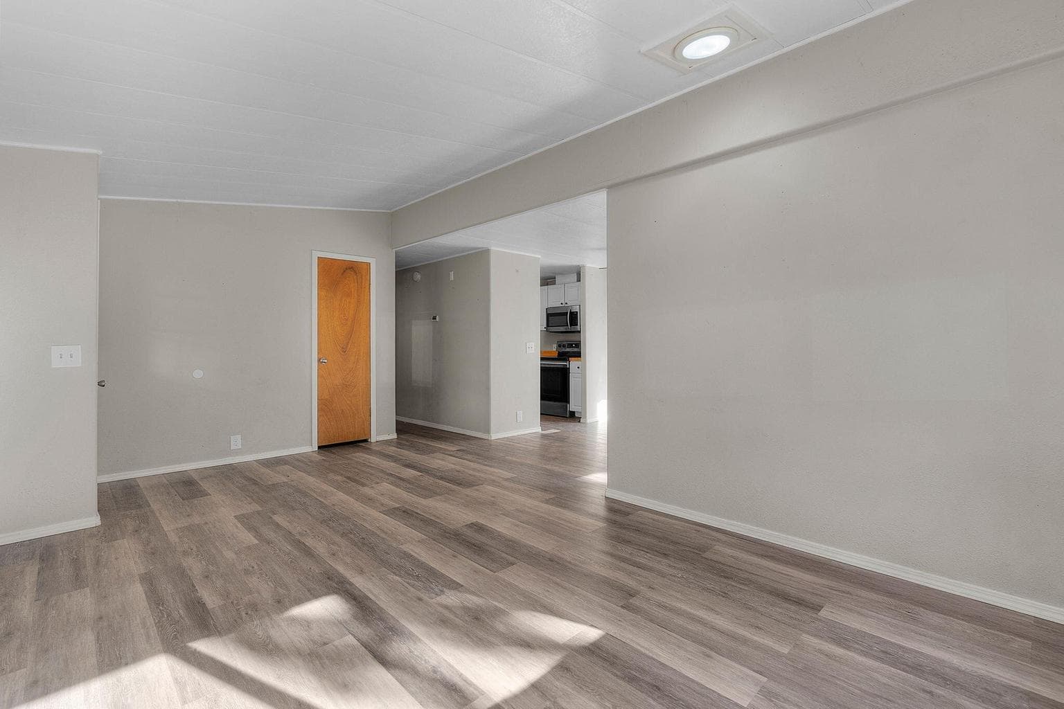 View towards the kitchen from the main living space.
