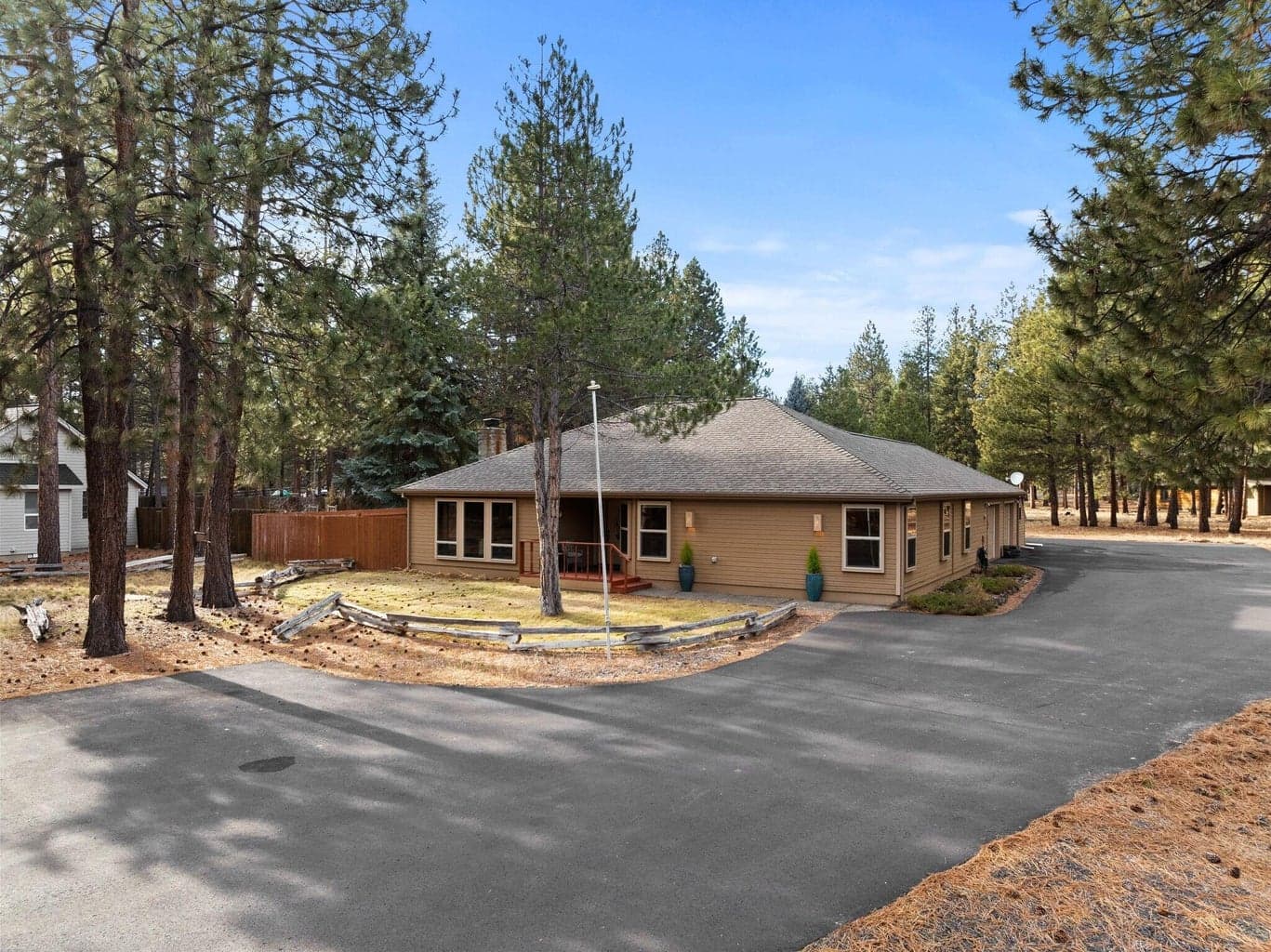 Set back for privacy with easy access and plenty of parking for guests, gear, your RV, and toys.