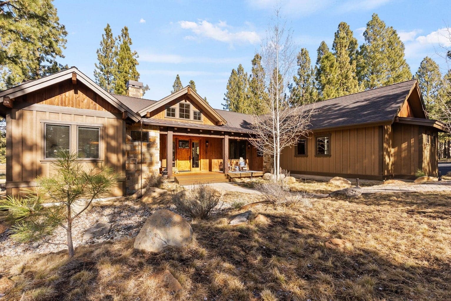 Welcoming covered front porch with peaceful golf course setting.