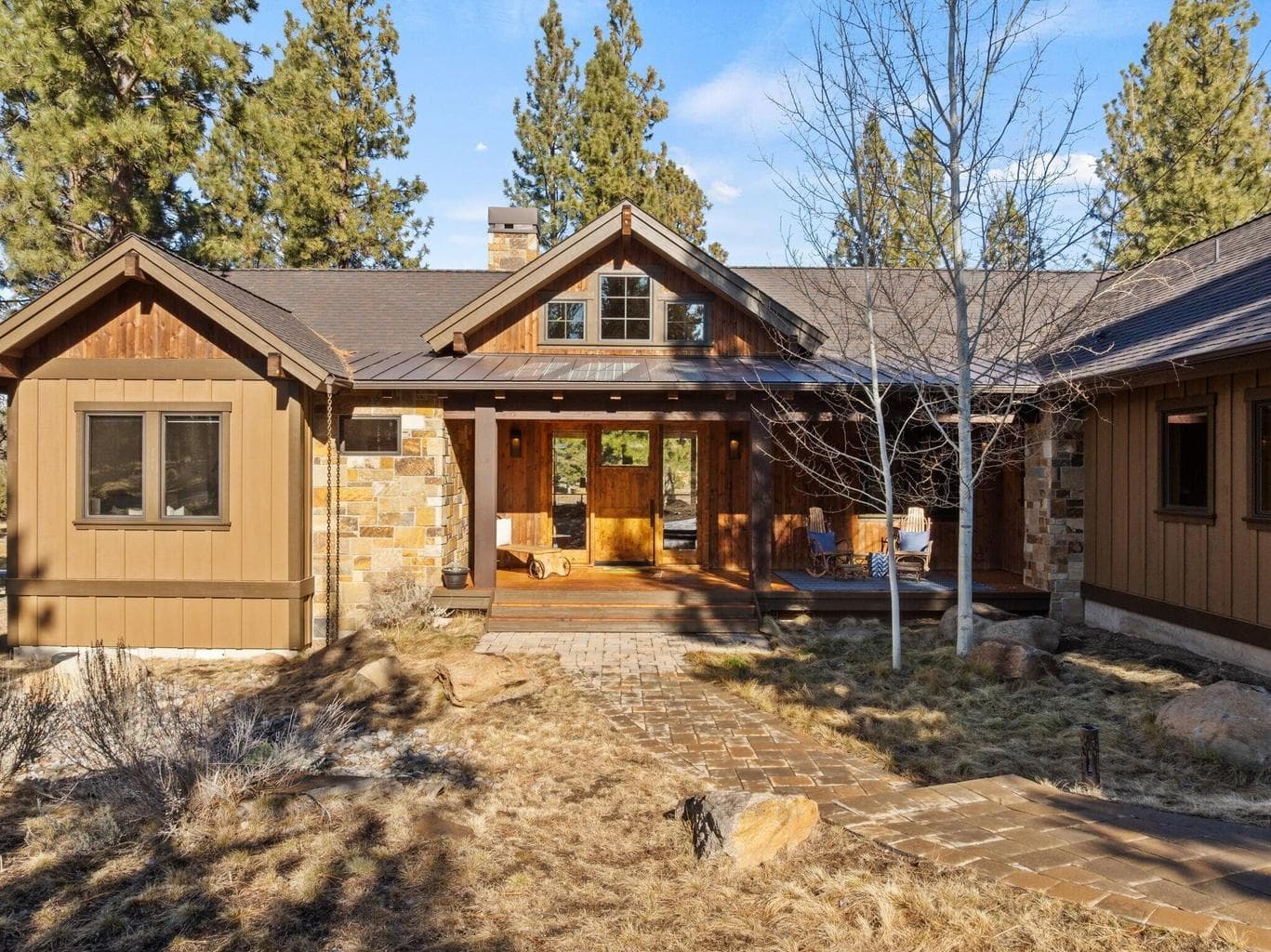 Welcoming covered front porch with peaceful golf course setting.