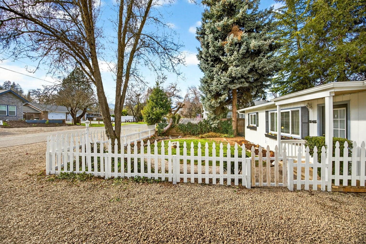 White picket fenced front yard