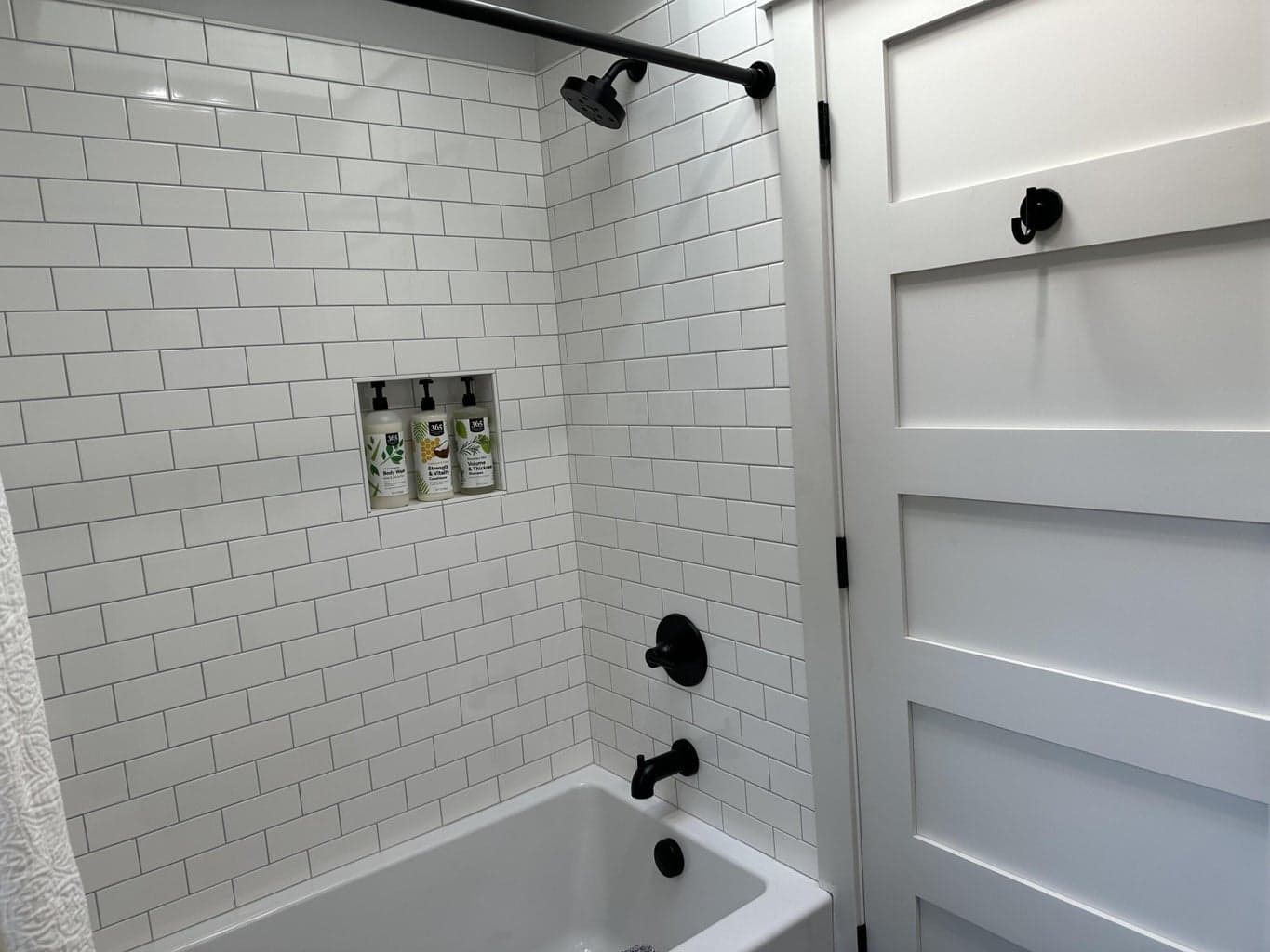 Fully tiled shower.