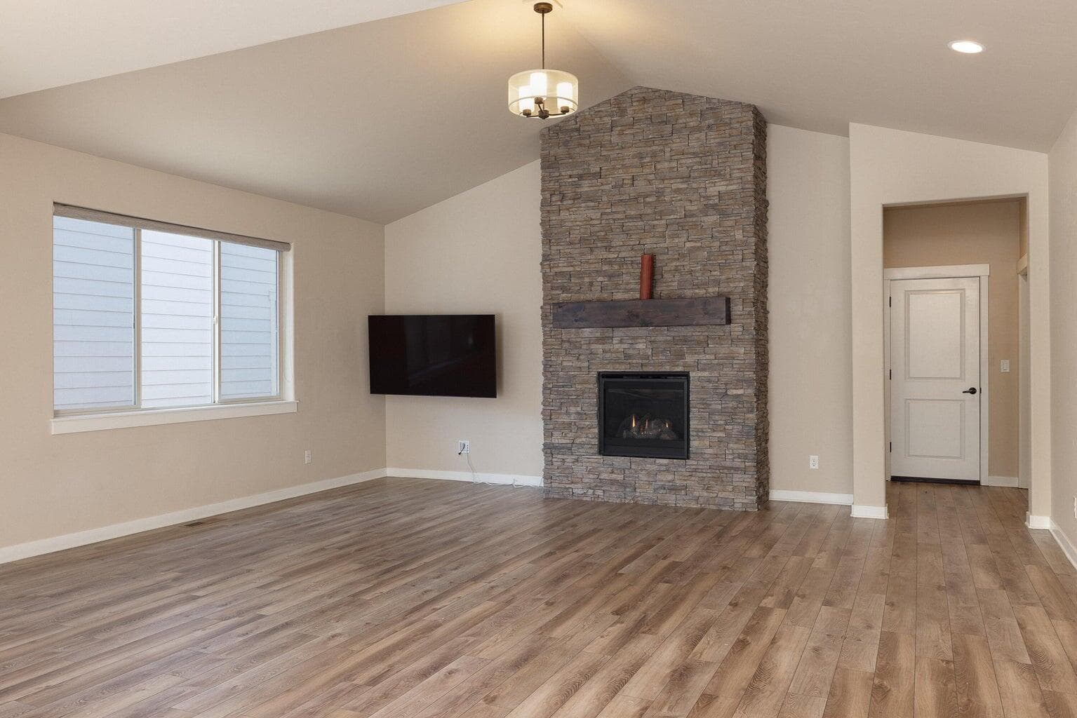 Great Room with floor to ceiling fireplace.