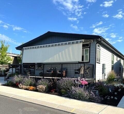 Retractable awning with sunshade for front deck