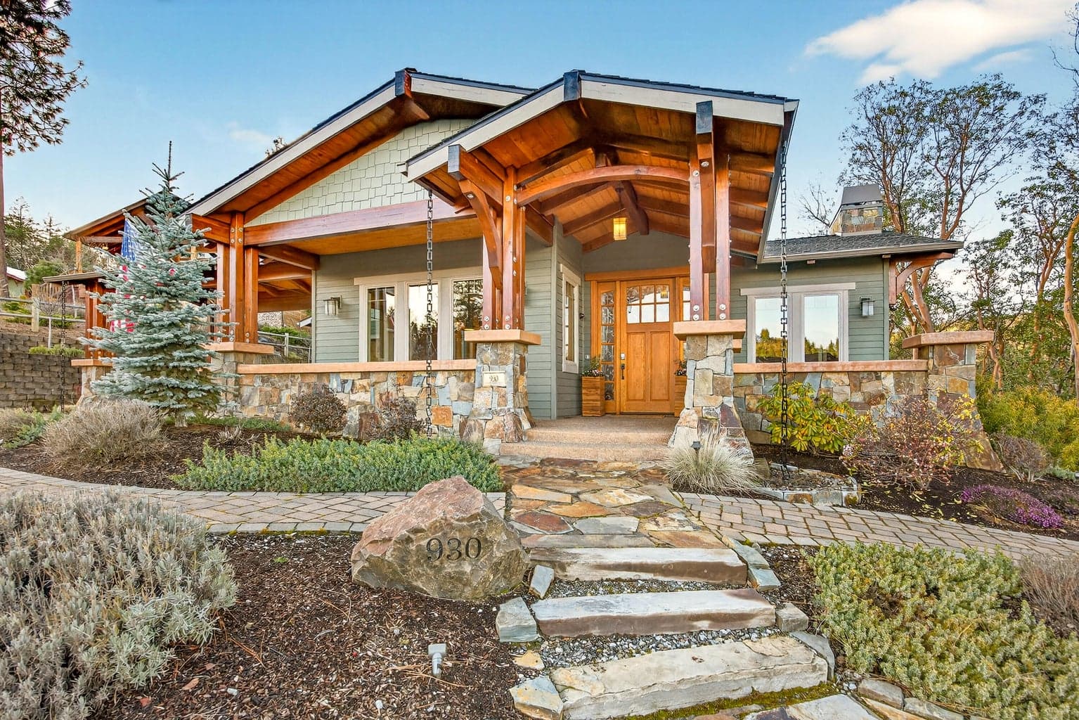 Exposed beams and tongue & groove soffits throughout exterior.