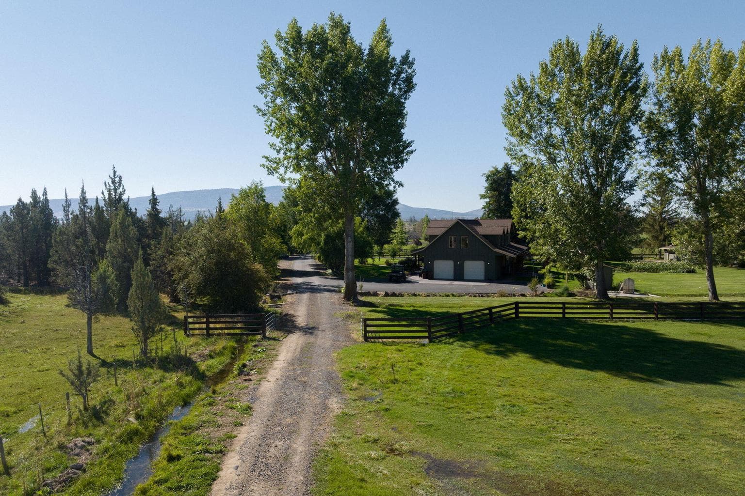 gravel road into hay field