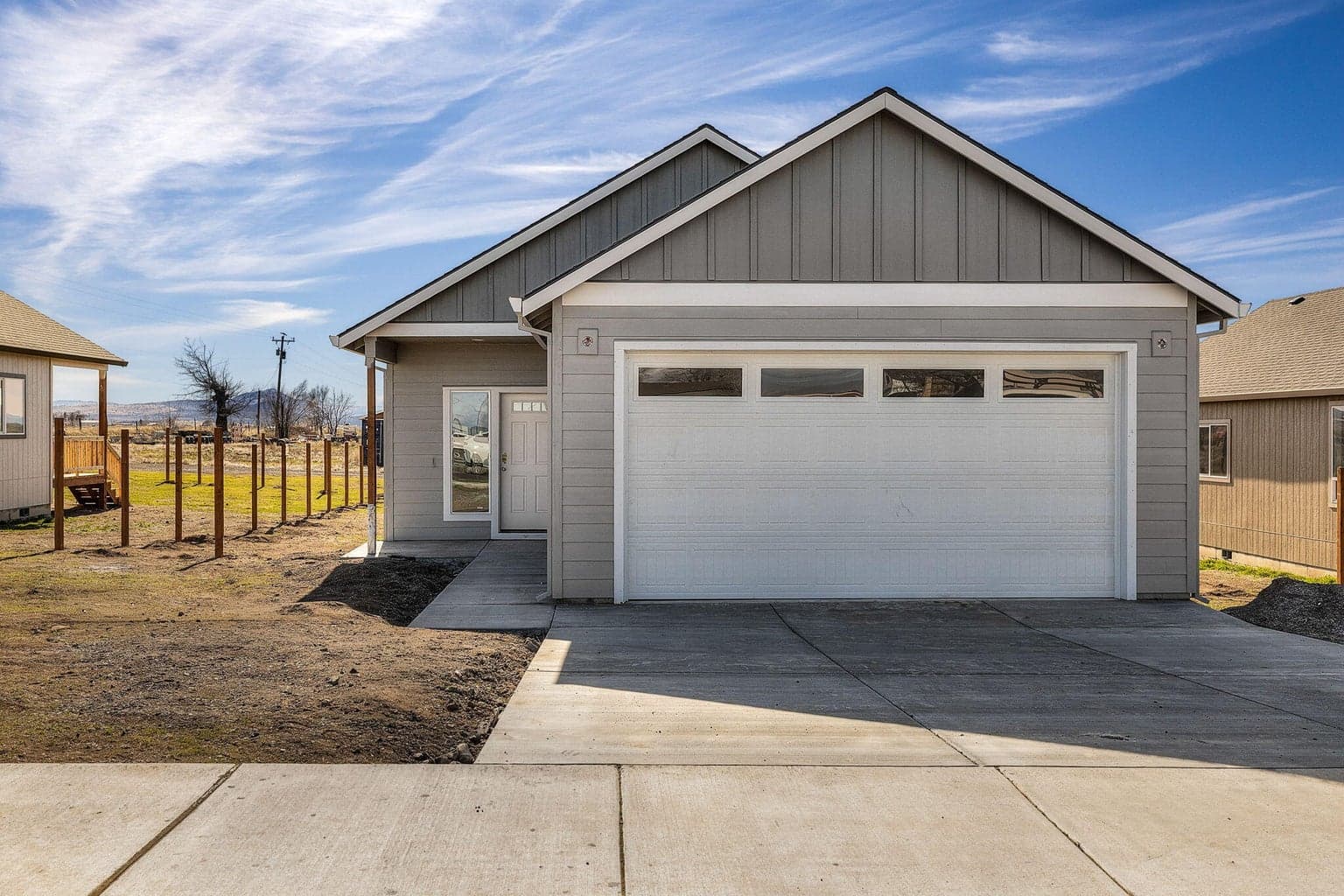 Alternate exterior angle featuring the driveway and yard.