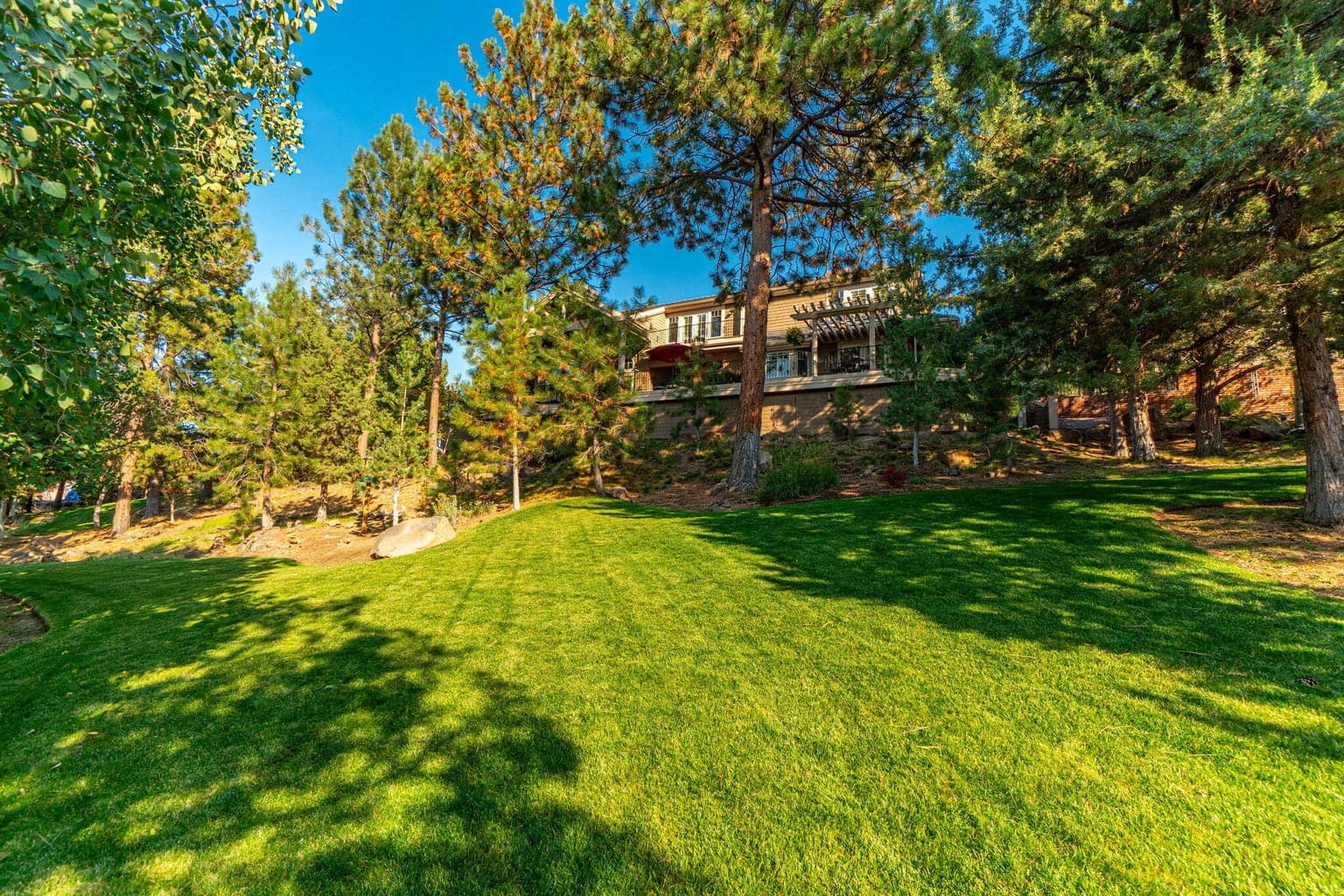 Tucked beneath a canopy of pines with plenty of room to roam, this backyard delivers a perfect blend of natural beauty and mountain-facing serenity—1.13 acres of high-desert peace with the Cascades always in view.