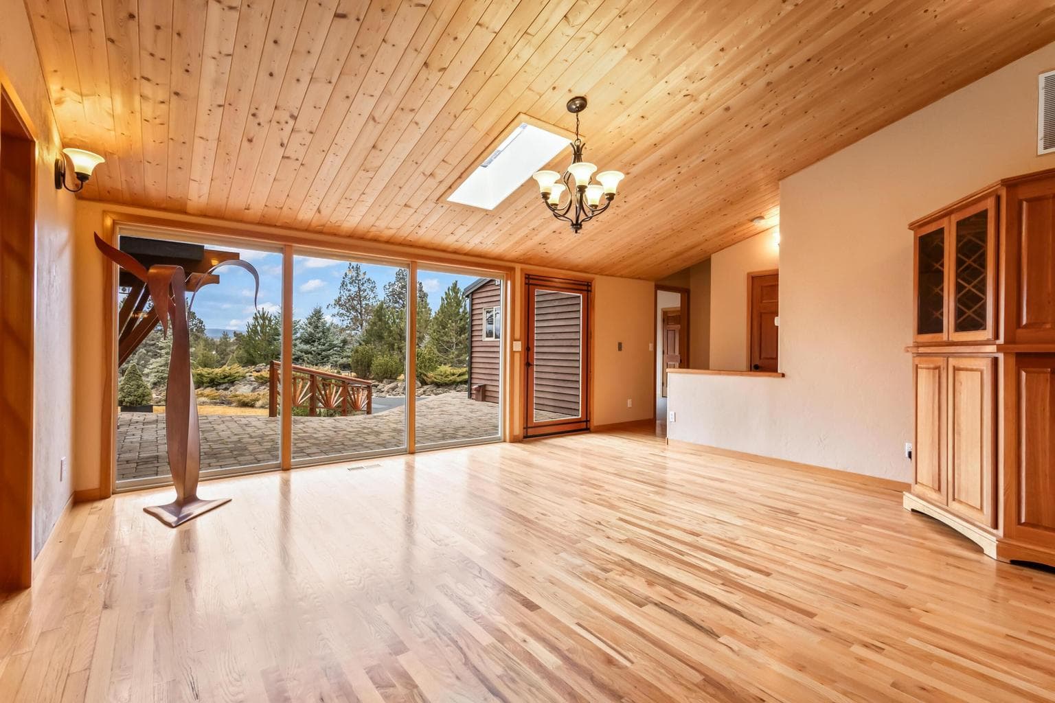Dining area is warm with wood, yet light and bright with windows and gorgeous views