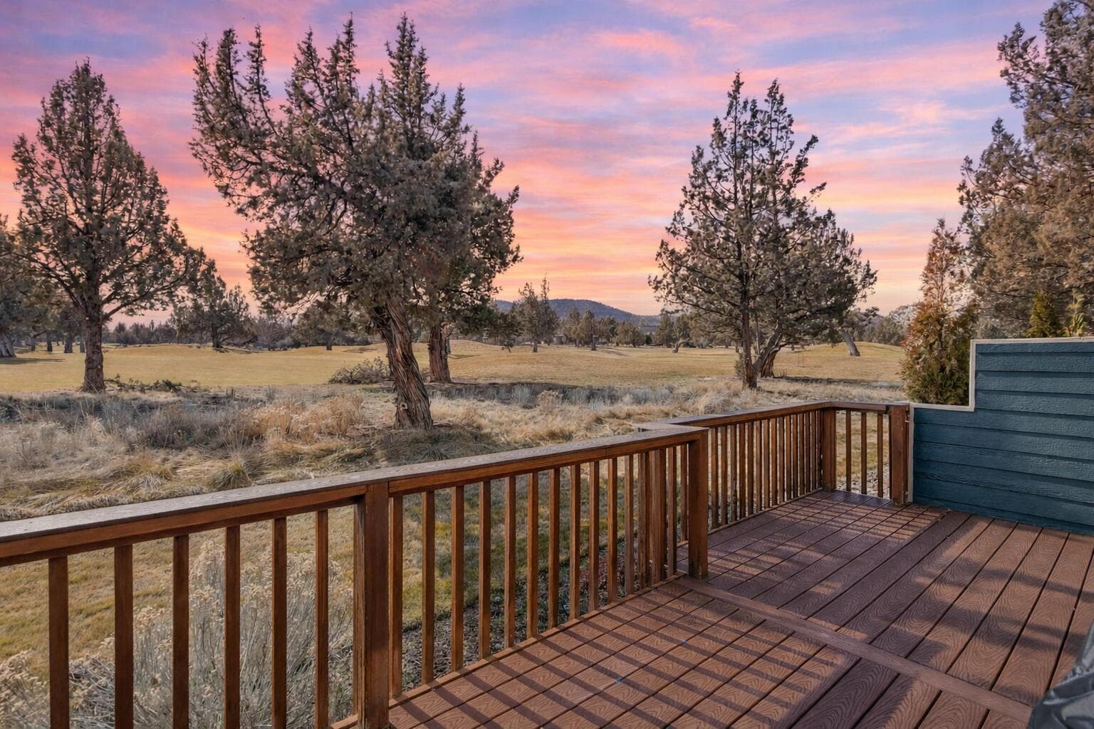 Views of the green from the back deck - depiction of the Central Oregon sunset is digitally altered.