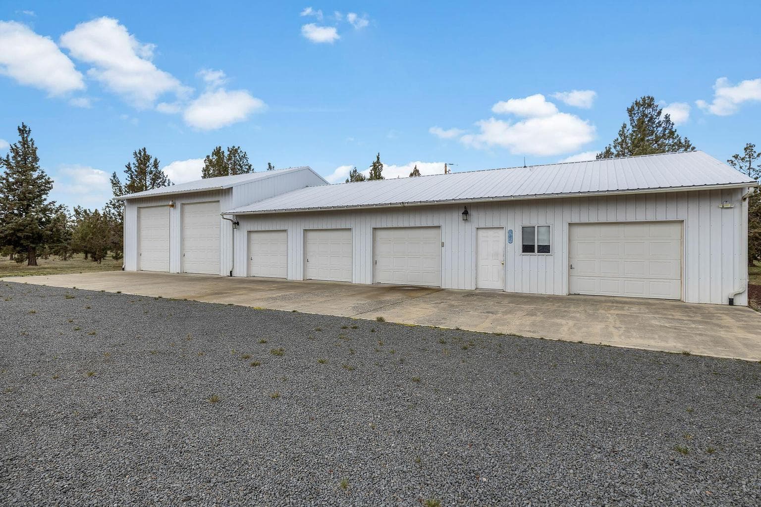 Huge 6-car garage/shop with 35’ deep bays and two 12’ RV doors