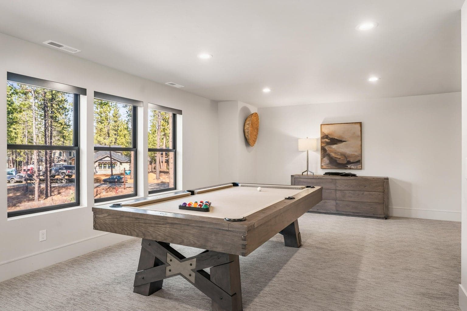 A bonus room with a pool table, and a spacious living area ideal setting for family.