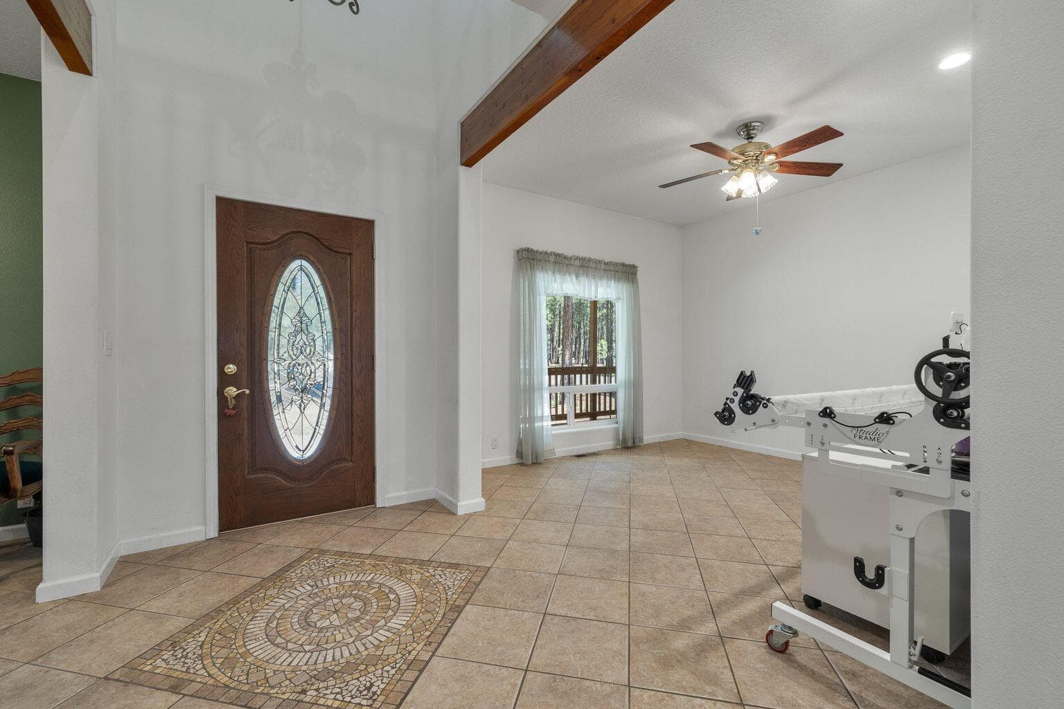 Entrance foyer with beautiful tile work and bonus room