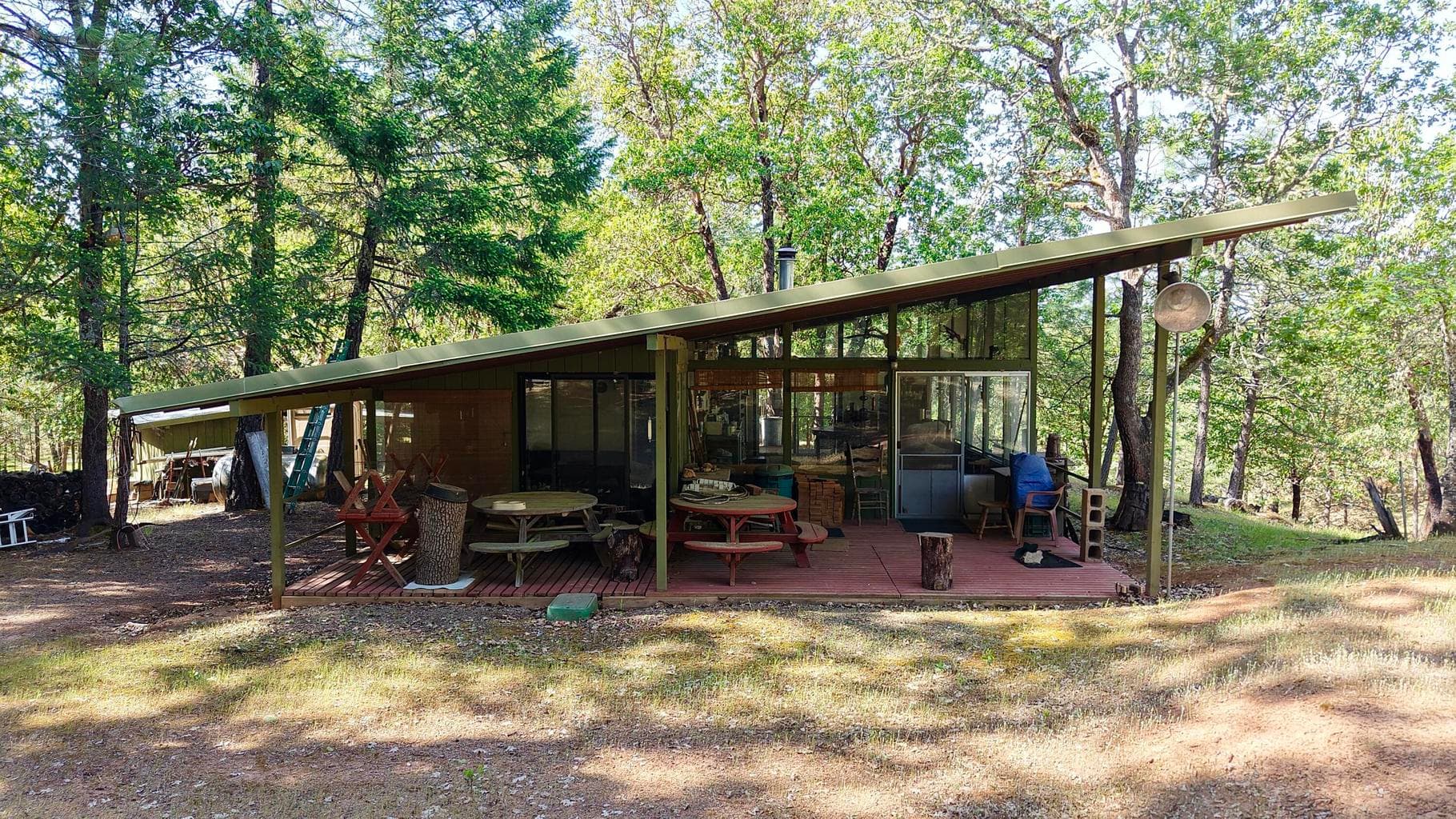 Covered back Porch. Two nice pick-nic tables and more for your outside entertainment