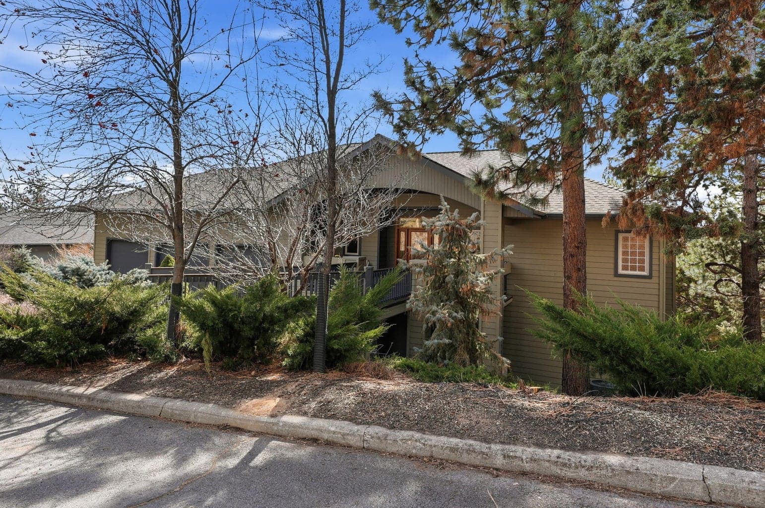 Front foliage adds privacy from the street. One of the best lots in all of West Hills.