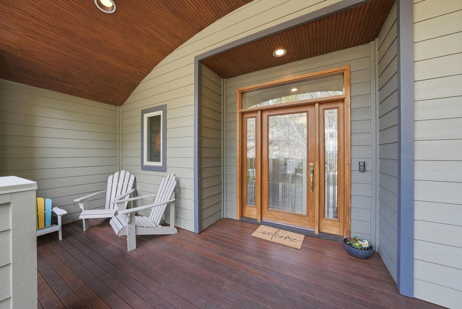 A welcoming covered entry with a tongue-and-groove ceiling sets the tone for this exceptional home, with a front entry and deck perfectly suited for enjoying your morning coffee.