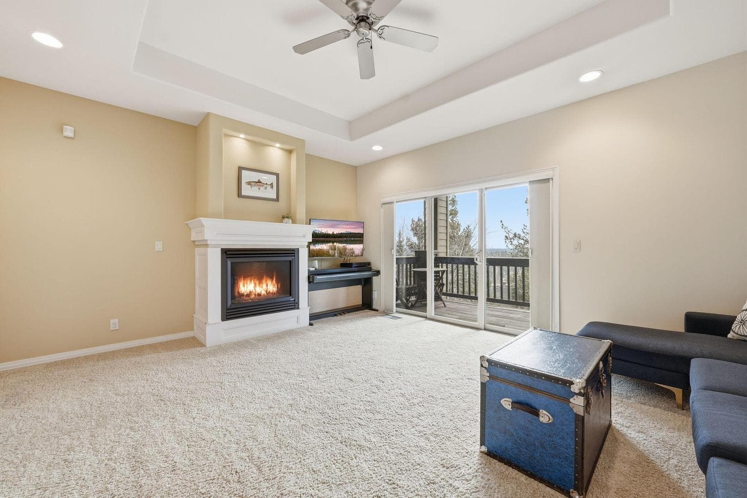 With soaring 10-foot ceilings and expansive windows, the lower level feels open and inviting, offering natural light and views that elevate the space. Bonus room features a gas fireplace and slider to private deck.