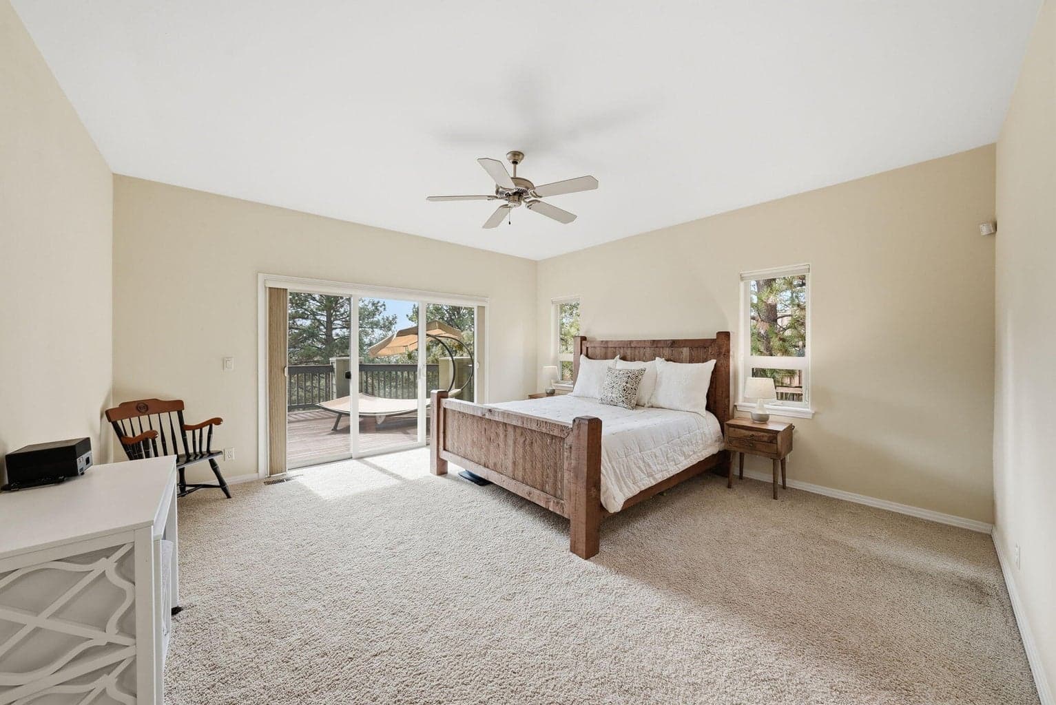Main level Primary suite with direct access to private deck, a perfect spot for a future hot tub
