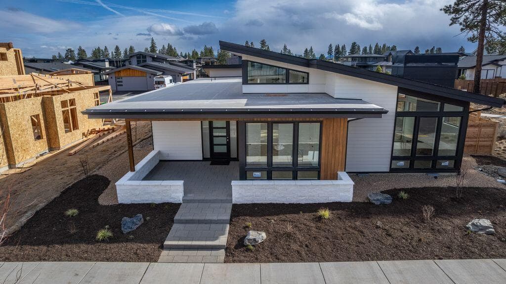 The roofing is a combination of composition shingle on the angled sections and TPO on the lower flat areas.