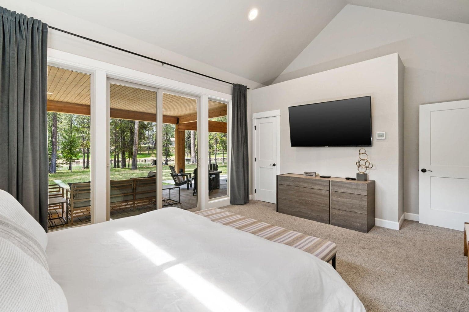 Main level luxury primary suite with full river views