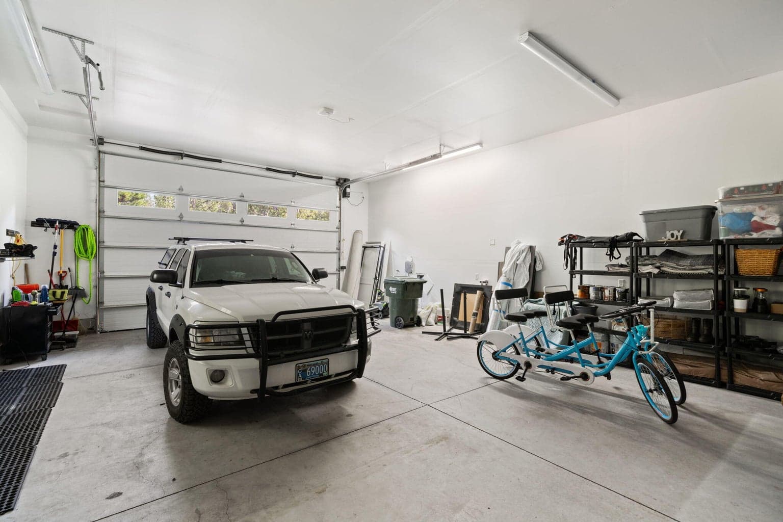 Oversized RV garage includes space for multiple vehicles plus a tall RV-height bay, ideal for an RV, boat, or recreational gear.
