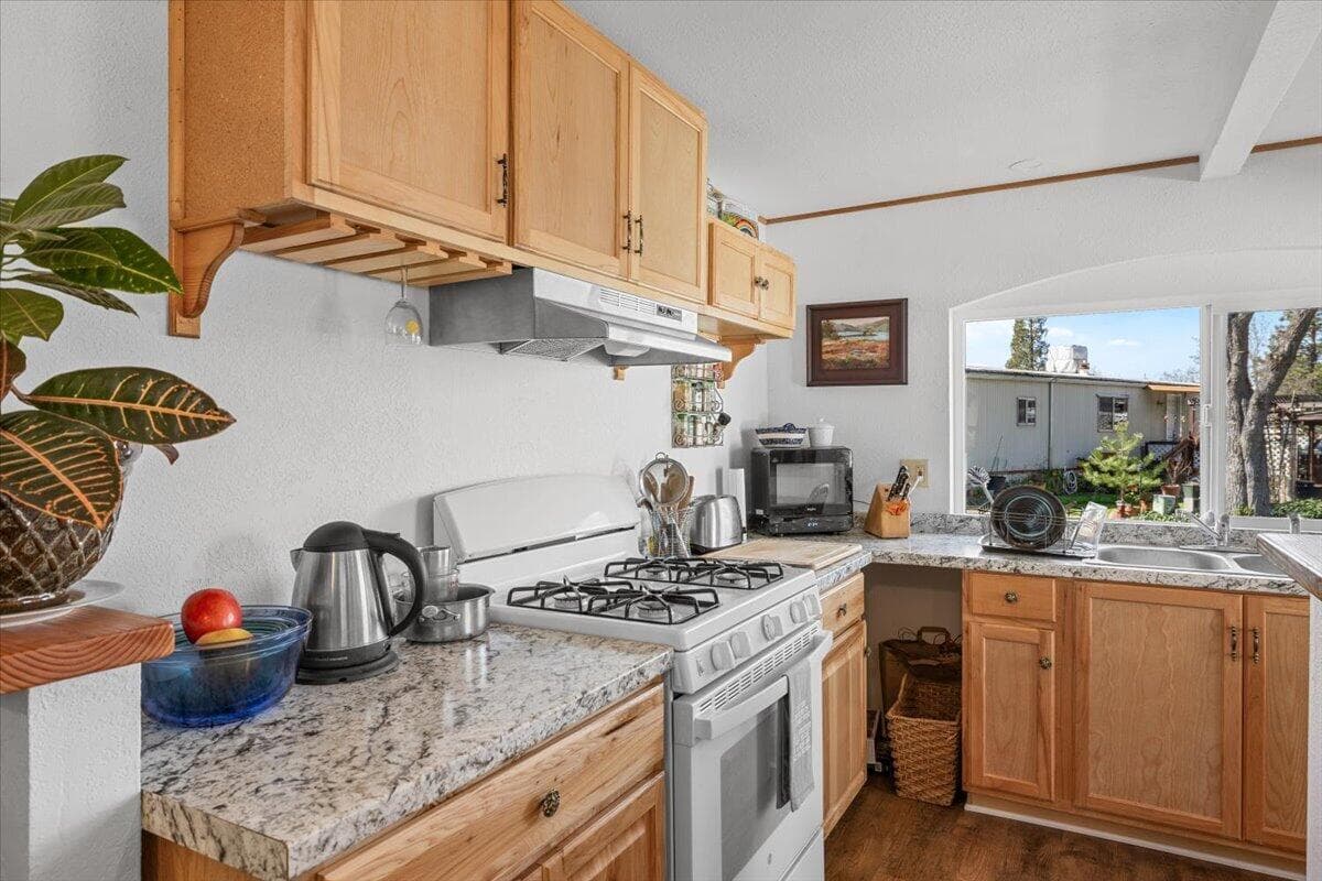 Kitchen is functional and includes newer appliances.