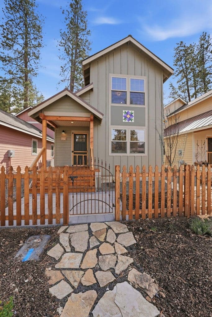 Paver front walkway leads to easy to maintain landscaped low maintenance front yard.